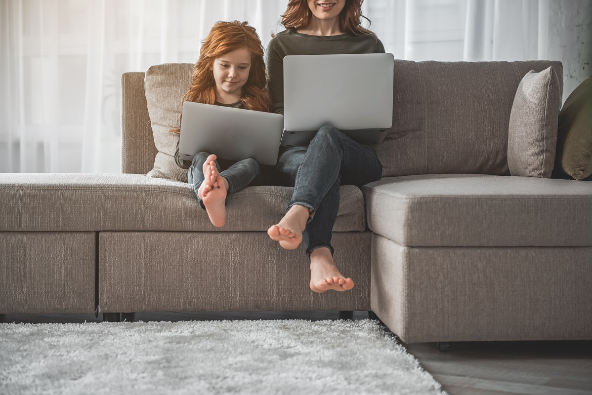 mother and child on their laptop